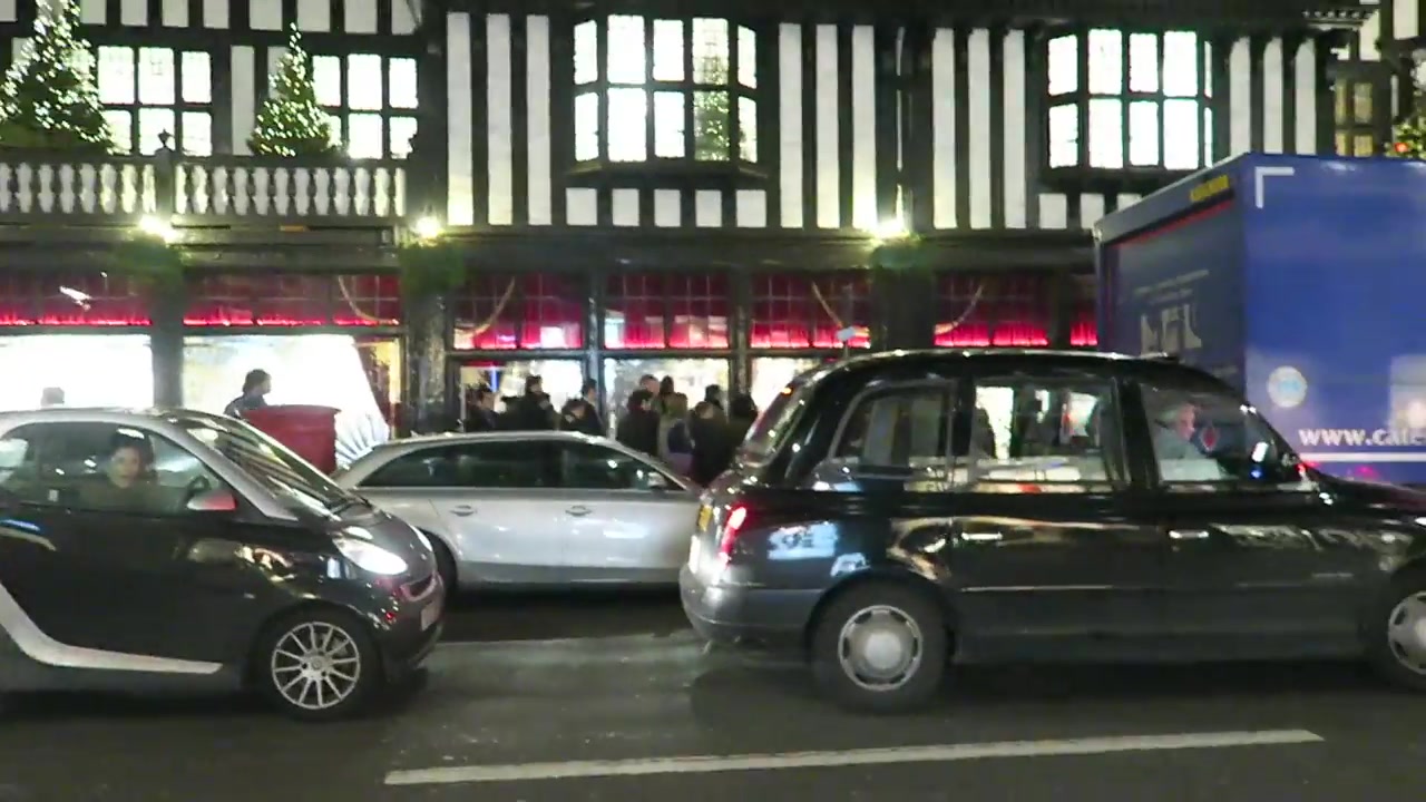 Liberty London’s Tudor Revival façade illuminated at night in December 2016