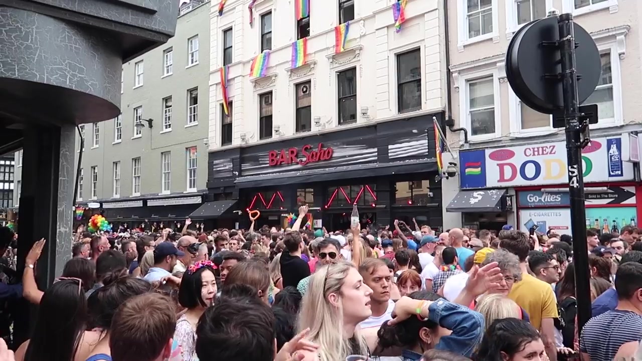 Crowds filling a Soho street during Pride.