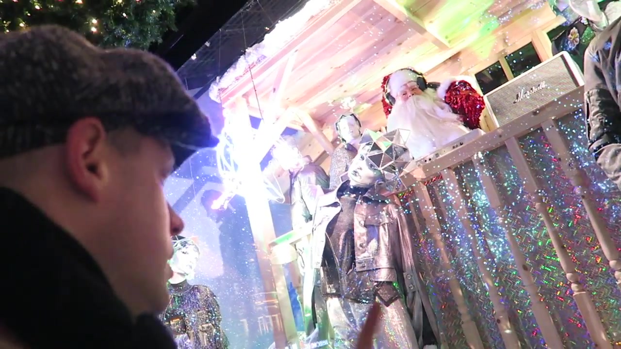 Glittering disco-themed Selfridges Christmas window with Santa and mannequins