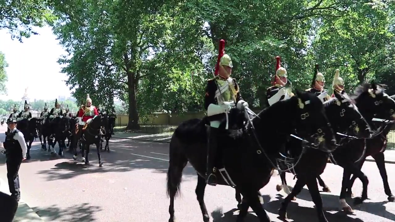 Household Cavalry riders passing through St James’s Park during Trooping the Colour 2018