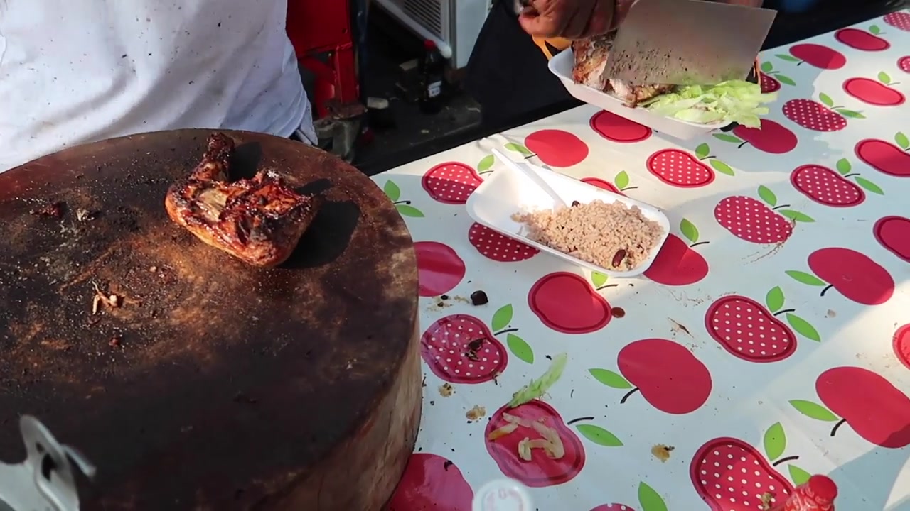 Caribbean jerk chicken being prepared at Notting Hill Carnival