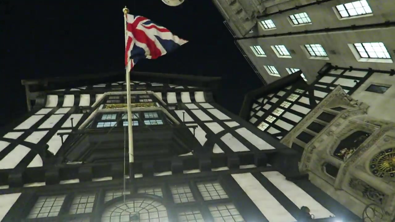 Liberty London’s timbered Tudor Revival frontage viewed from below at night in 2016