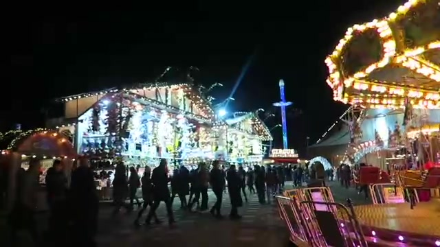 Illuminated stage and carousel at Hyde Park Winter Wonderland in 2016