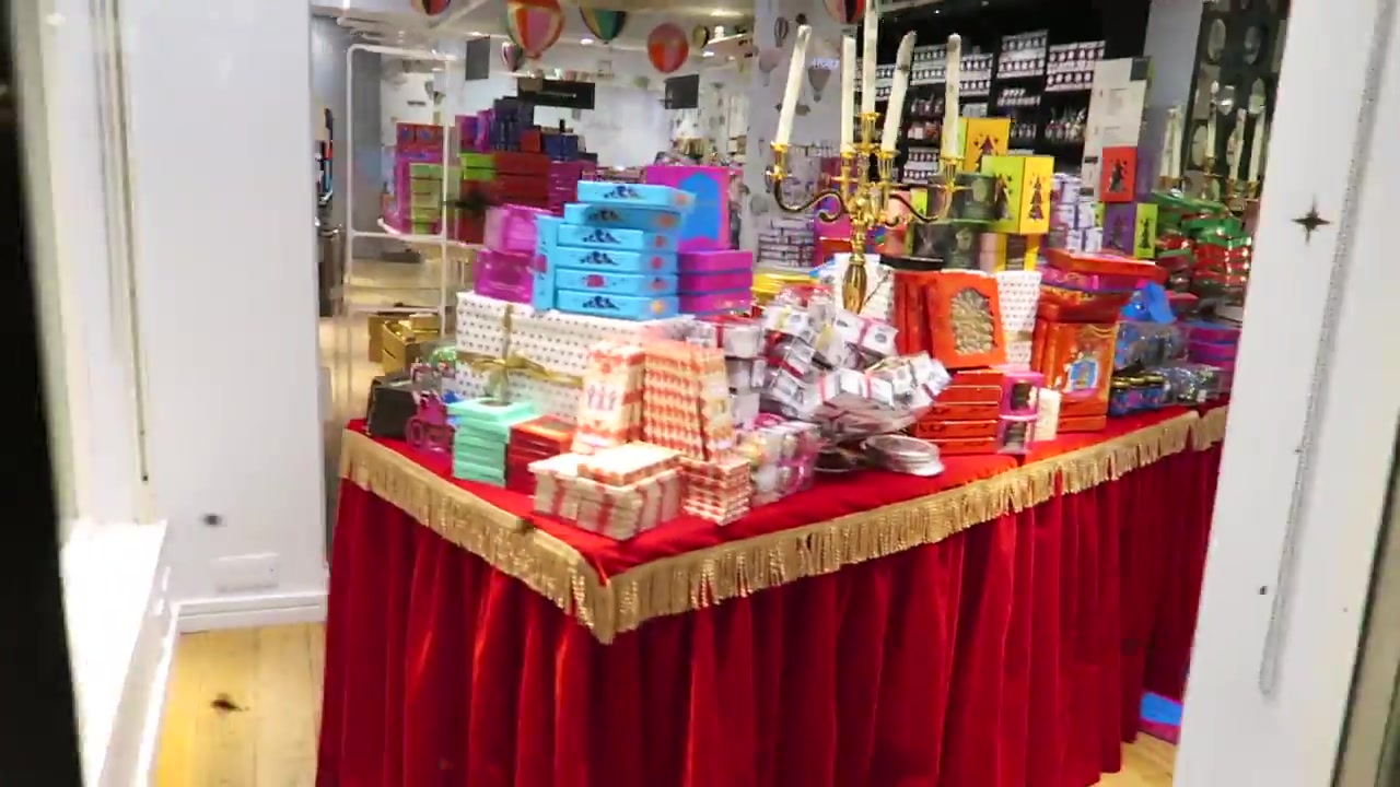 Colourful gifts and decorations arranged in Liberty London’s Christmas Shop in 2016