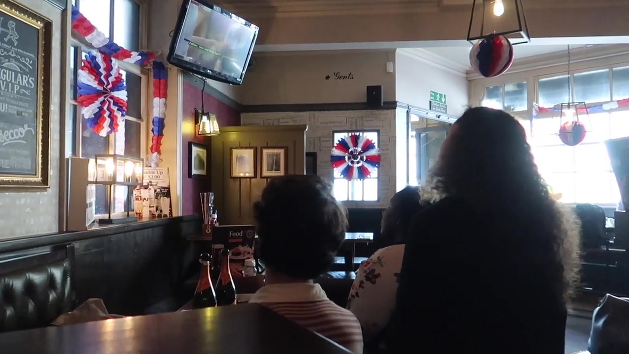 Customers watching the royal wedding broadcast inside The Two Chairmen pub