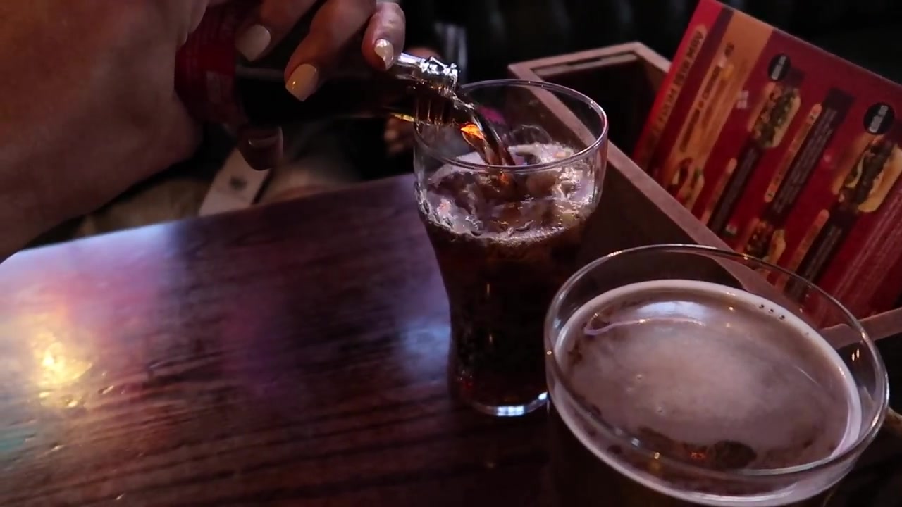 Drinks being poured at a pub table in Shepherd Market, Mayfair