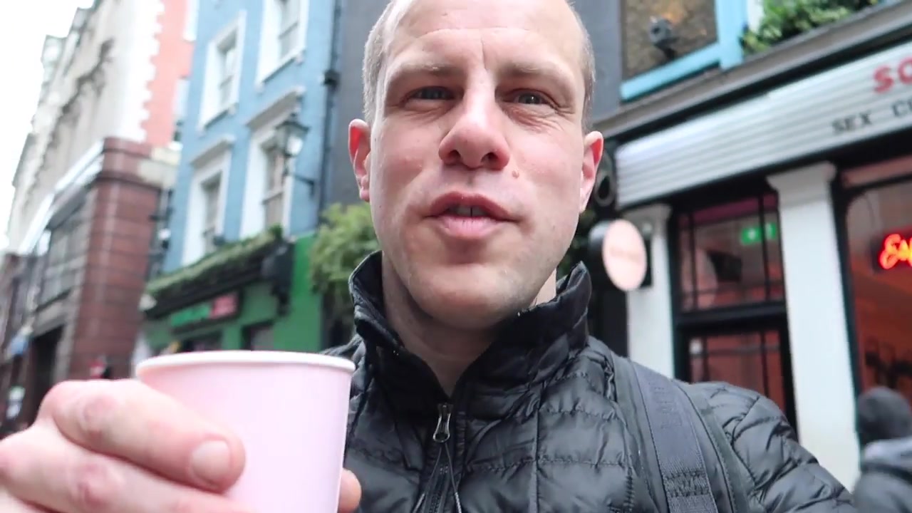 Drinking coffee outside Soho Grind in London