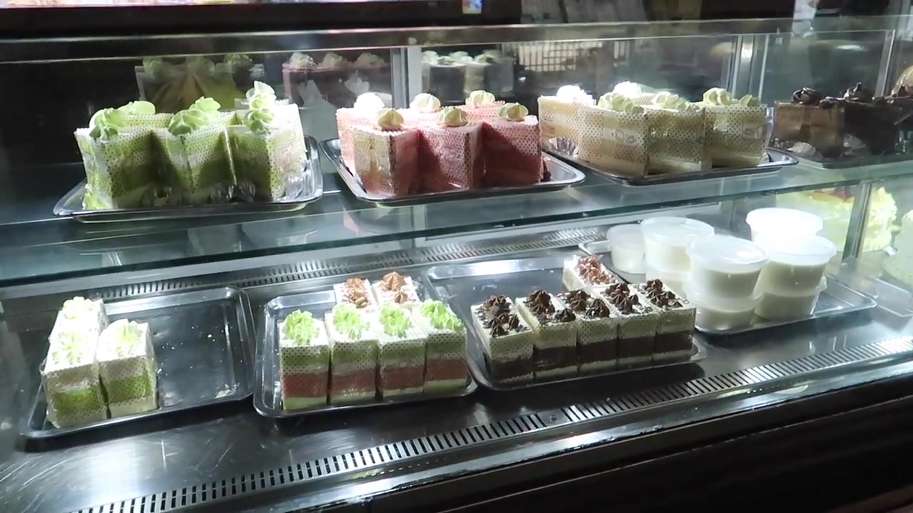 Colourful cakes in a Chinese bakery in London Chinatown