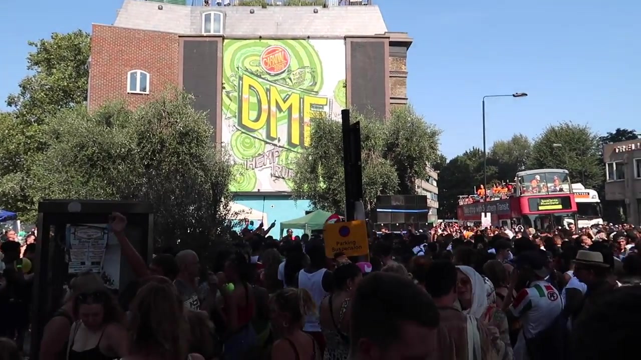 Performers and spectators dancing at Notting Hill Carnival