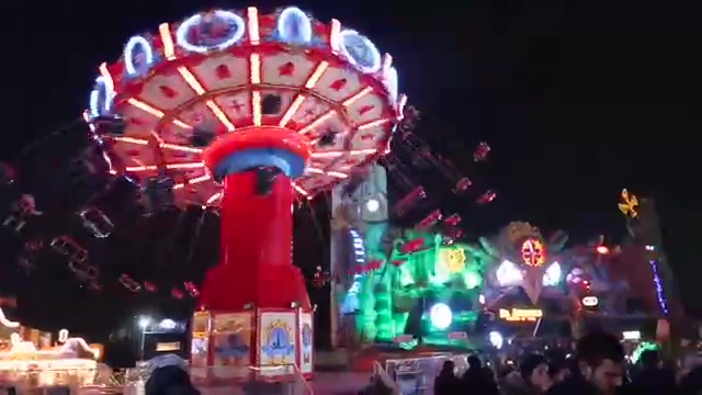 A brightly lit fairground ride at Hyde Park Winter Wonderland.