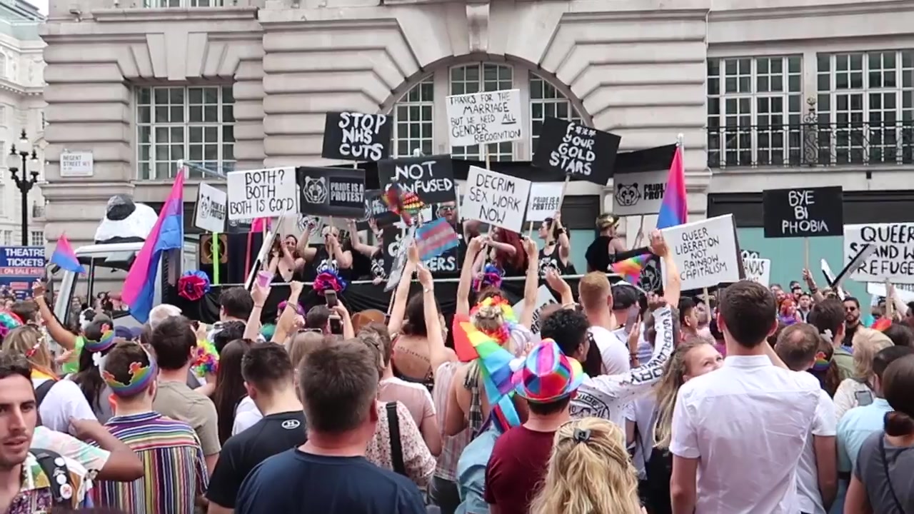 Marchers carrying banners through central London.