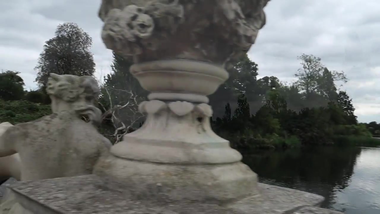 Carved stone ornament overlooking the lake in Kensington Gardens