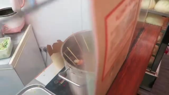 Skewers cooking in a pot inside the Baozi Inn takeaway kitchen