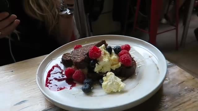 Banana bread with mascarpone, berries and flaked almonds at Beany Green