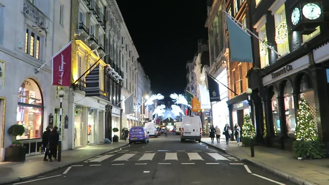 Night view along Old Bond Street with luxury shops and Christmas lights