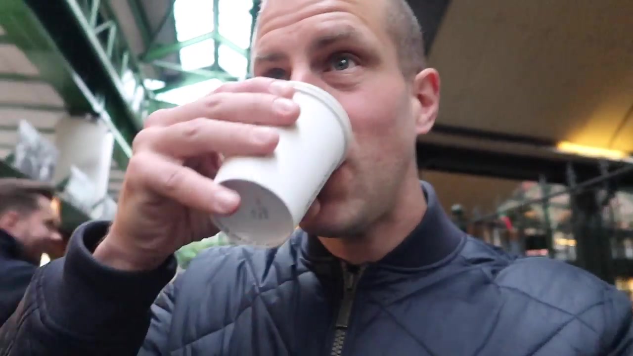 Barry Roberts drinking takeaway coffee at Borough Market