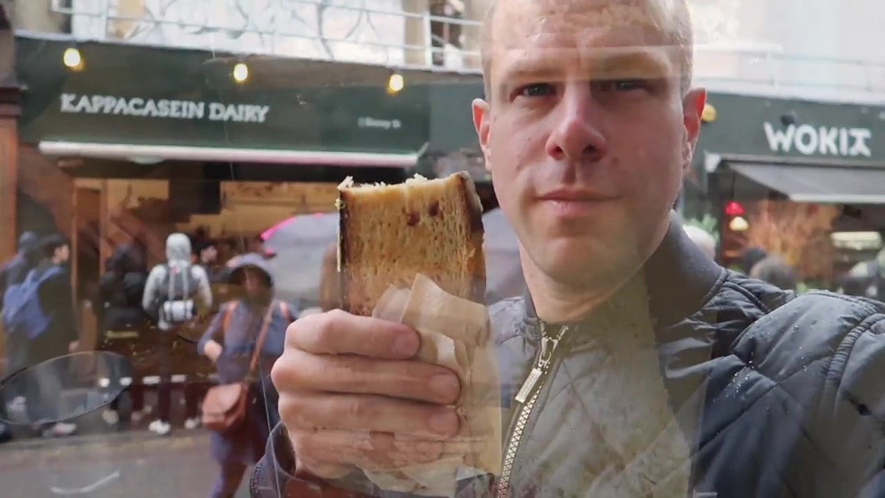 Barry Roberts holding a toasted cheese sandwich outside Kappacasein Dairy