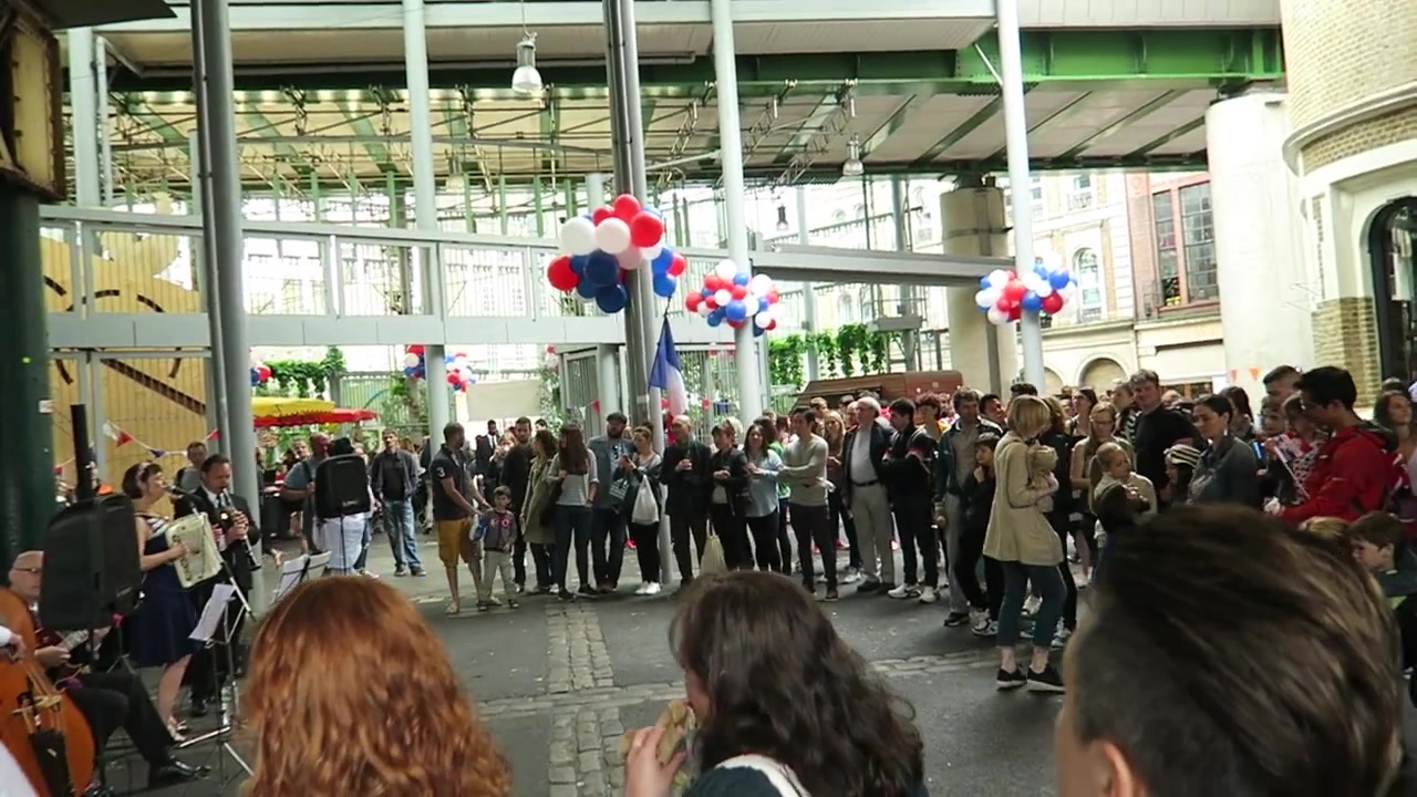 Crowd gathered around entertainment beneath Borough Market’s roof