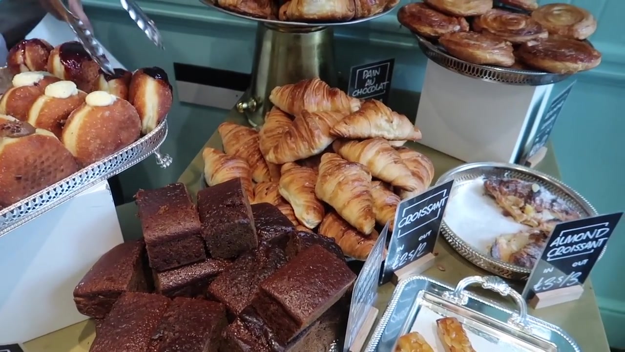 Doughnuts, pastries and cakes fill the bakery counter.