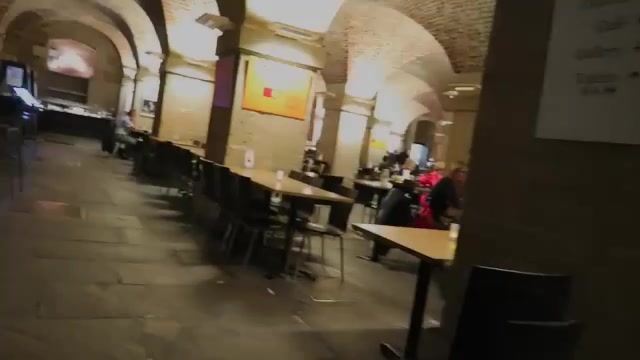 Tables and brick vaults inside Café in the Crypt at St Martin-in-the-Fields