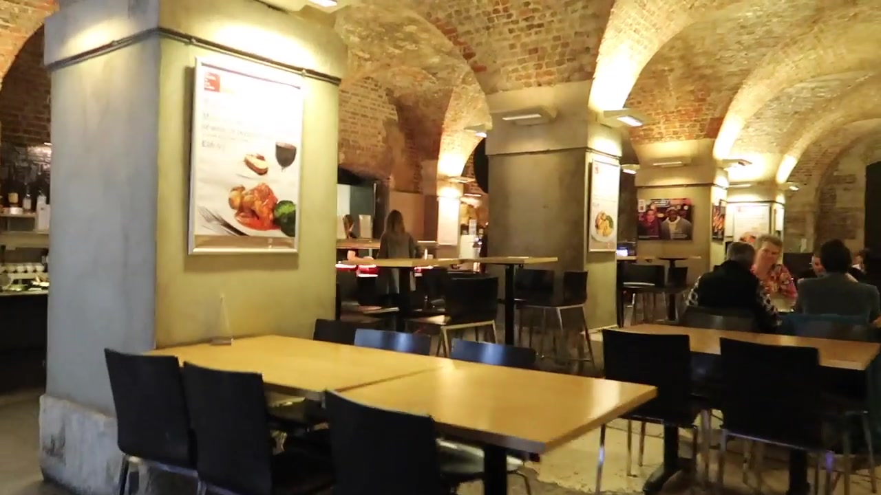 Tables beneath the brick vaults of Café in the Crypt.