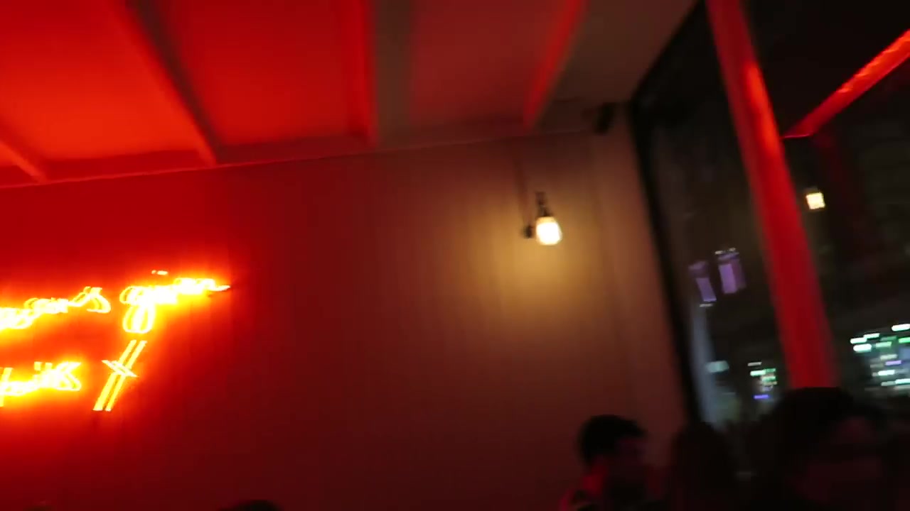 Red-lit interior and neon lettering at Soho Grind in 2016