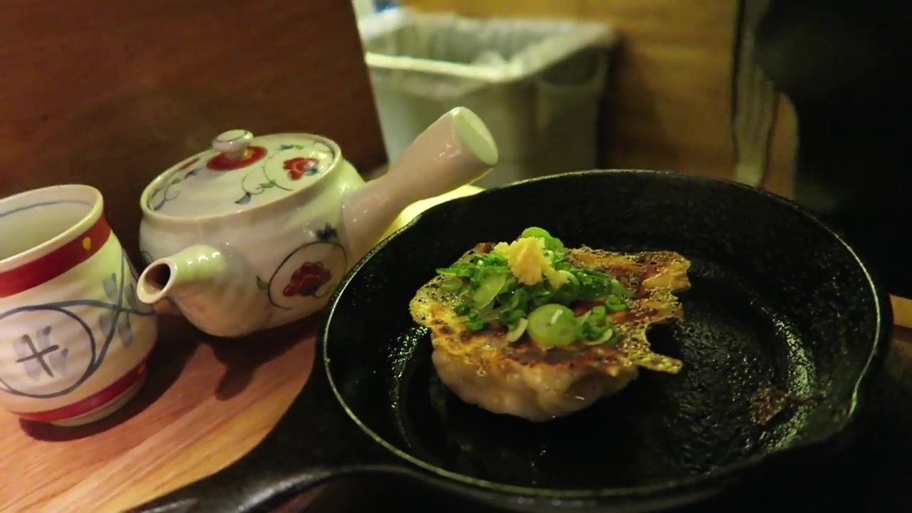 Pork gyoza dumplings on a cast-iron skillet at Shoryu
