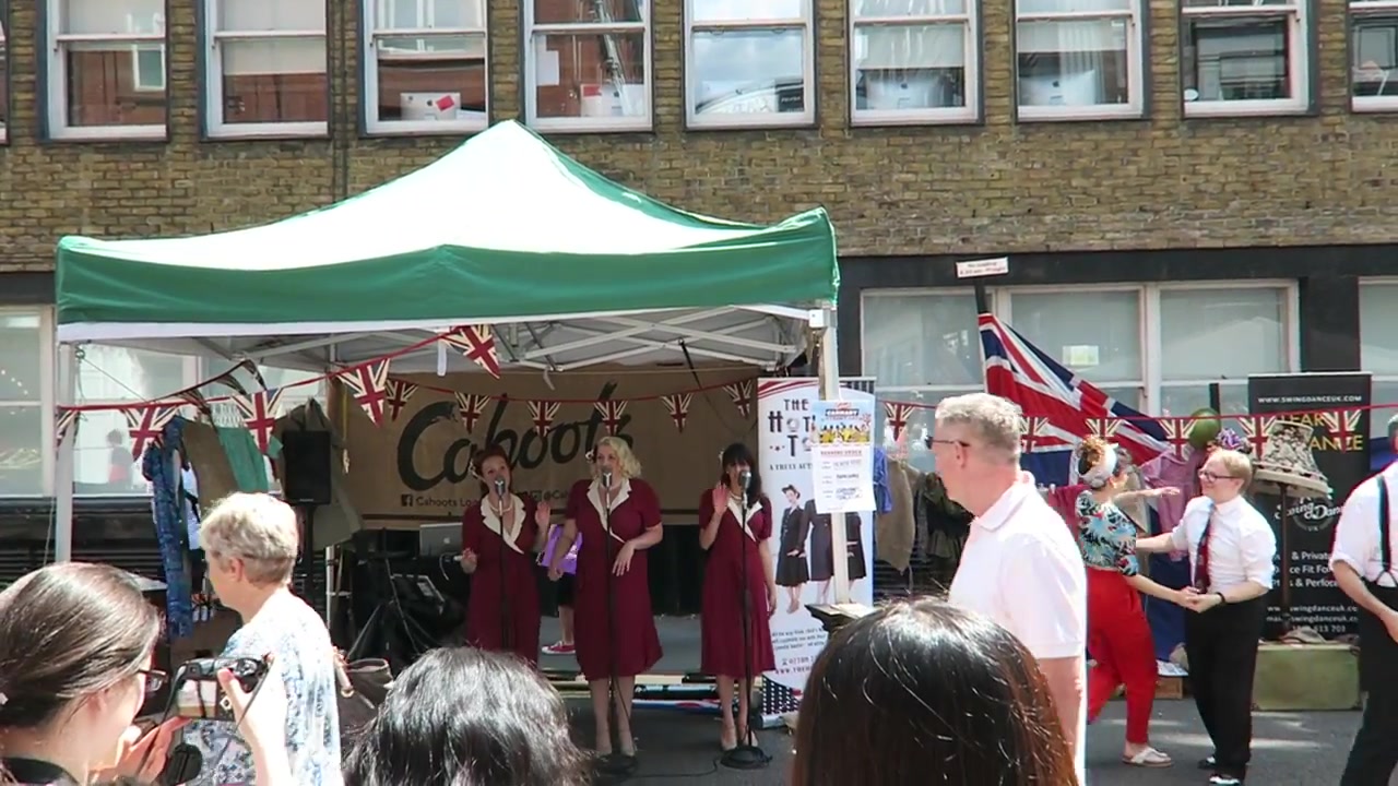 Performers in front of the Cahoots stall at Carnaby Street Eat