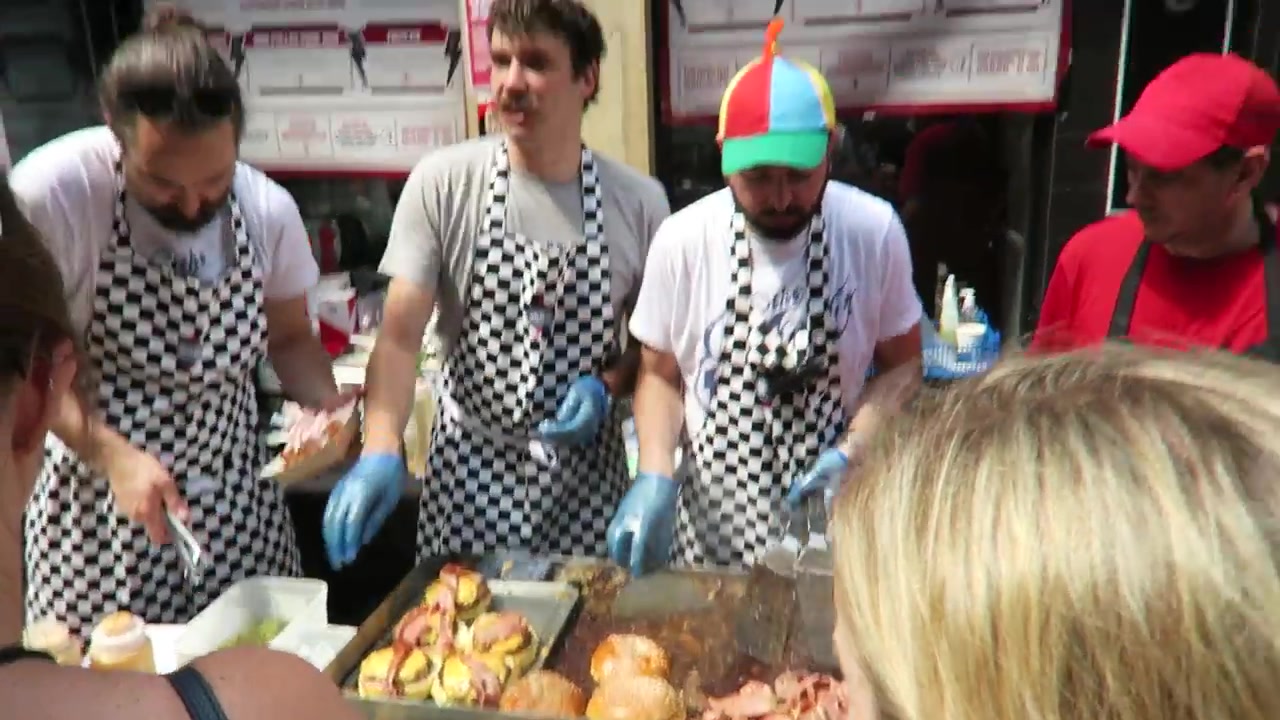 Cooks preparing burgers at The Diner’s outdoor stall