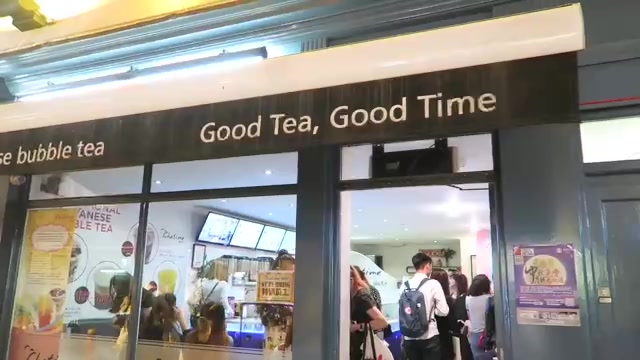 Customers at Chatime beneath the Good Tea Good Time sign