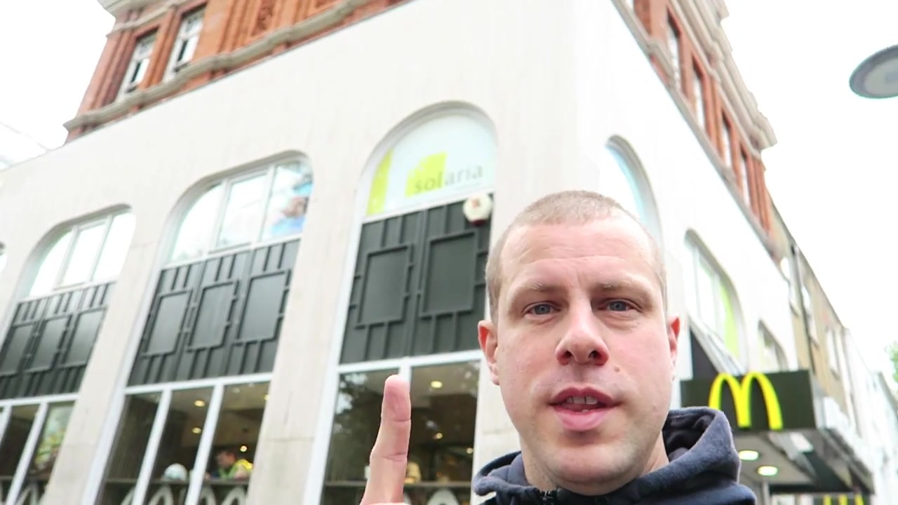 Barry outside the former Chelsea Drugstore with McDonald’s signs in 2016
