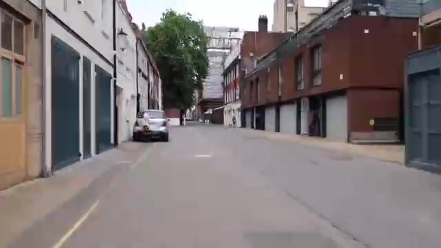 Quiet mews street with garages and houses on the Chelsea walk