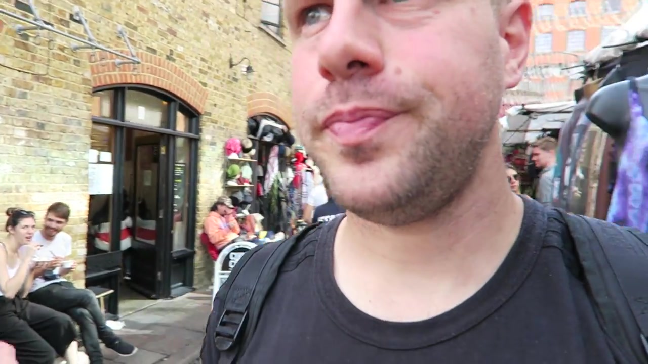 Barry Roberts walking through Camden Market after buying ice cream