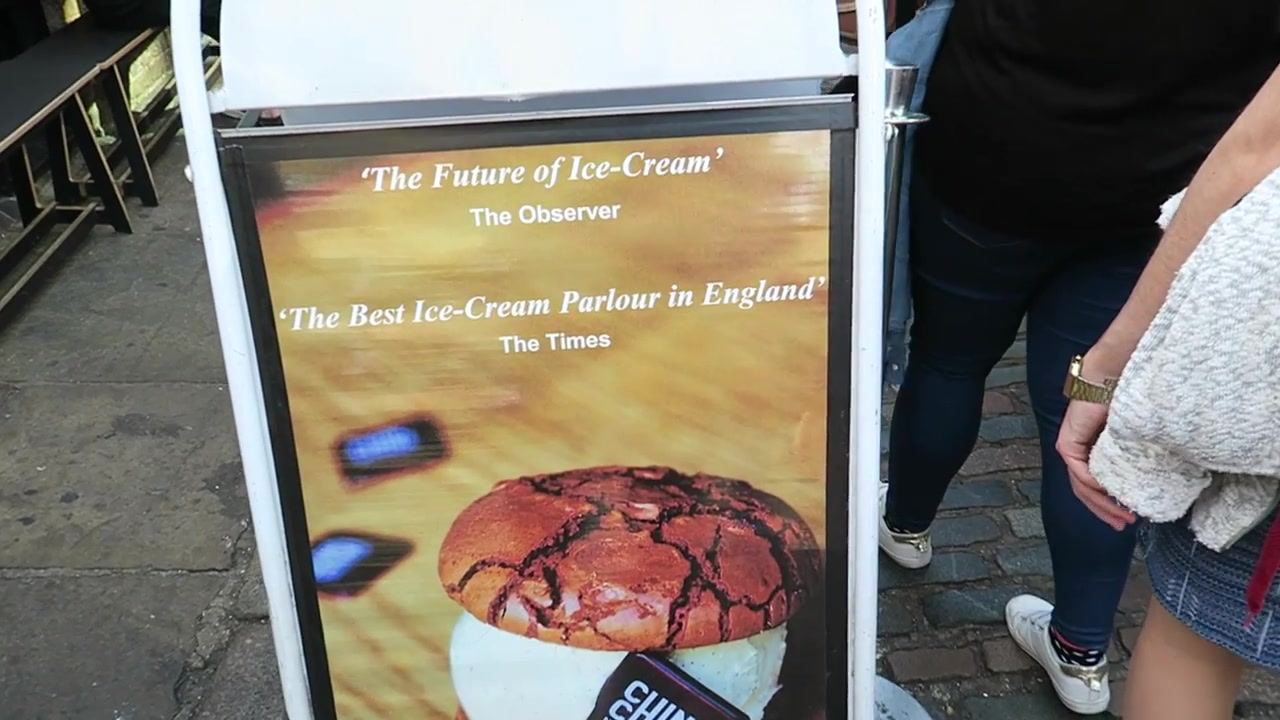 Chin Chin Labs ice cream sign beside a busy Camden Market passage
