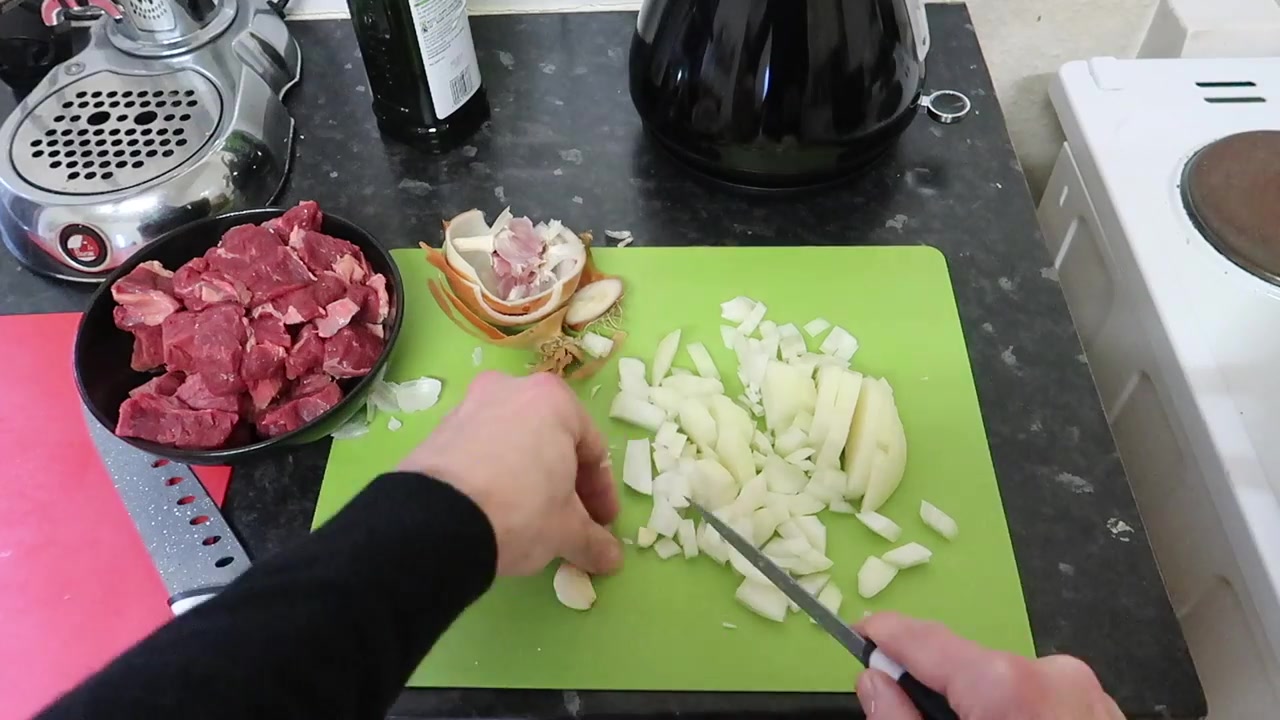 Bite-sized beef and chopped onion ready for the casserole.