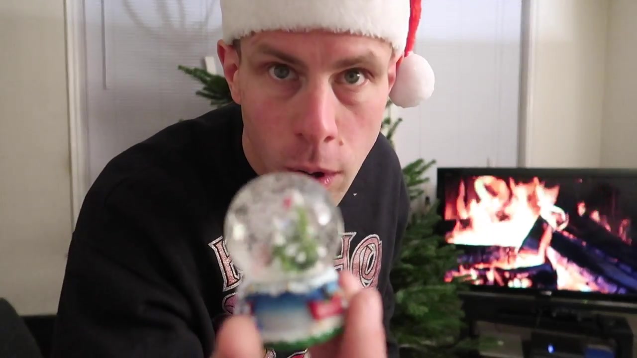 A snow globe joins the evening’s Christmas decorations.