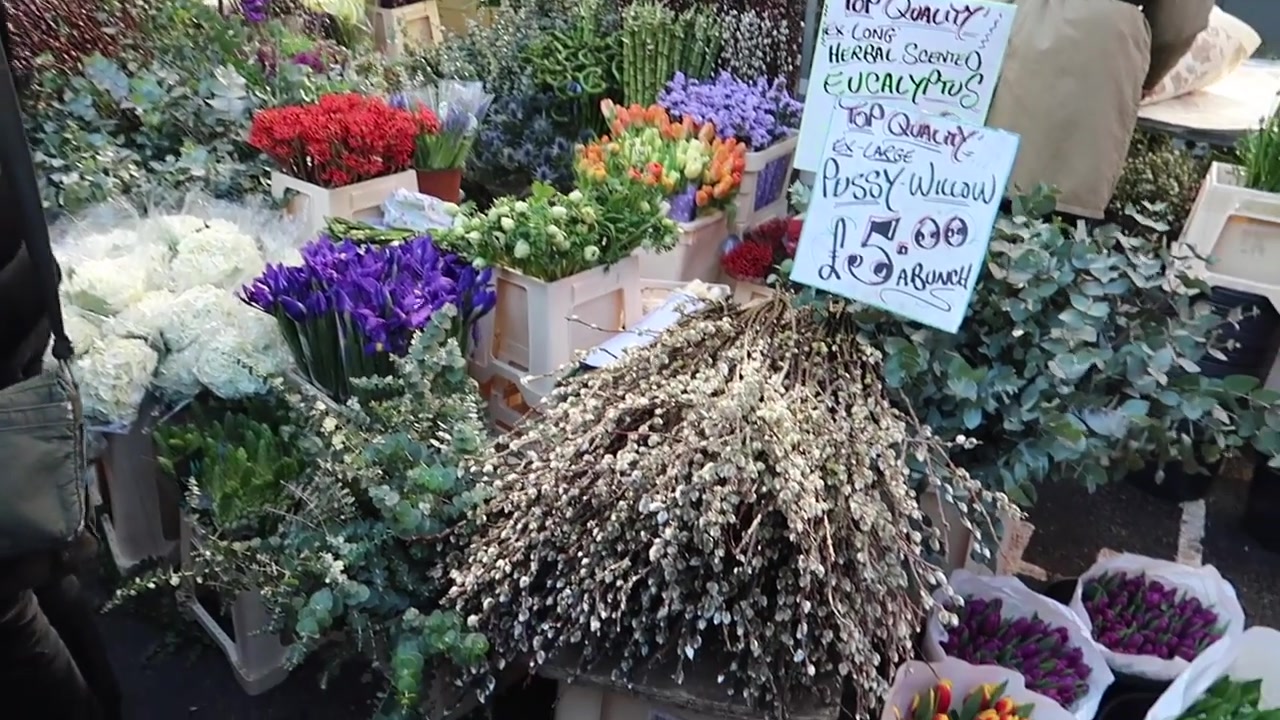 Colourful cut flowers and foliage at the market stalls.