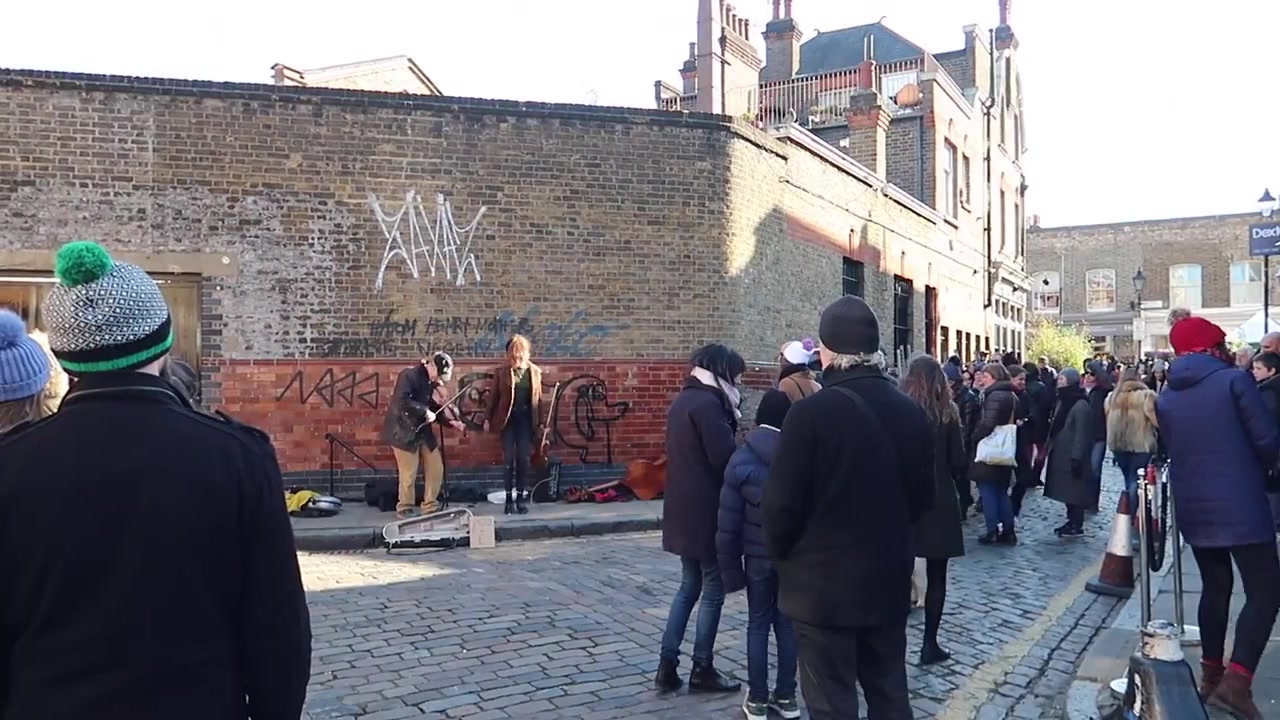 Street musicians add to the Sunday atmosphere.