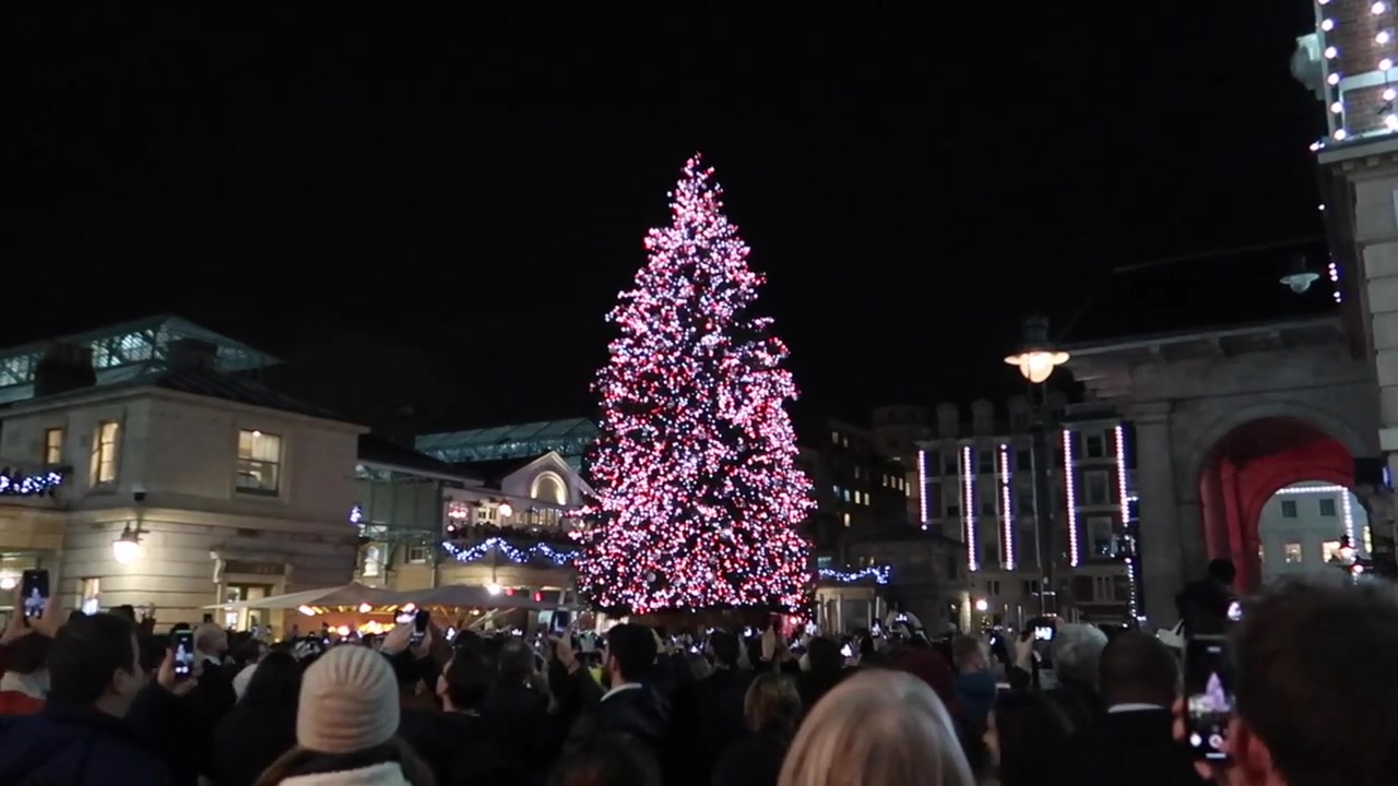 Illuminated Covent Garden Christmas tree above the Piazza crowd in 2018