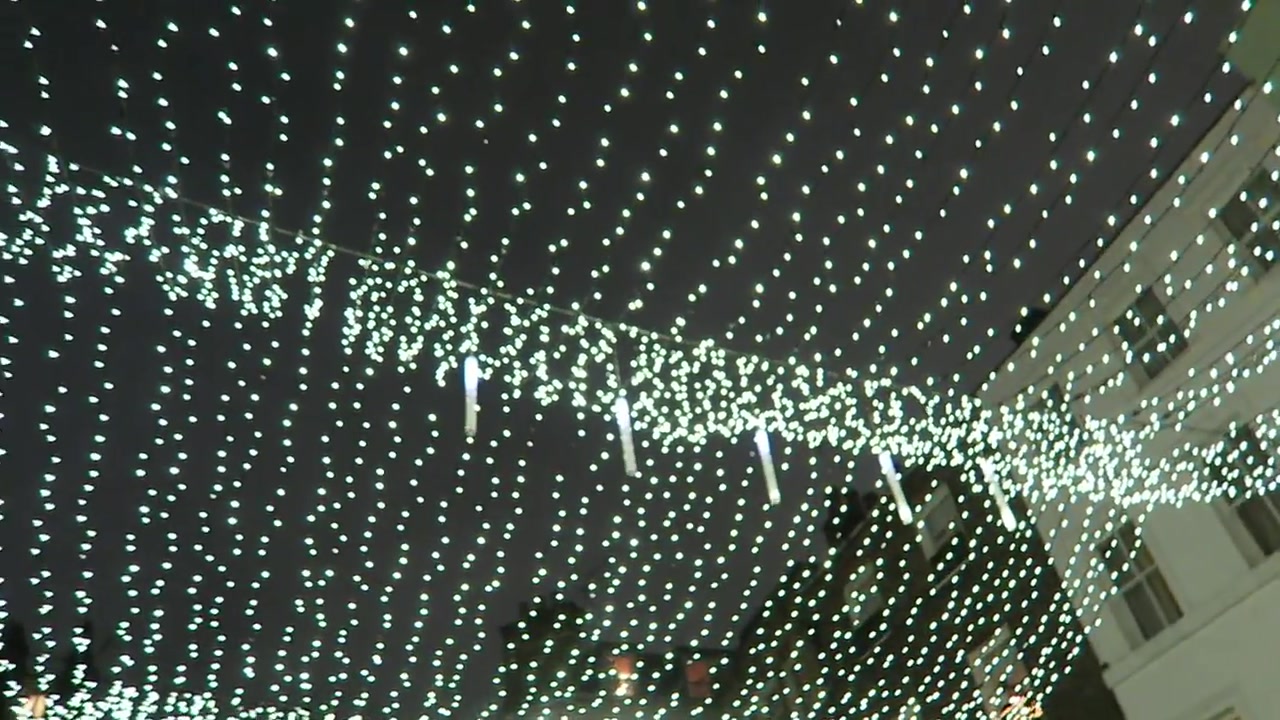 White Christmas lights forming a canopy above Shepherd Market in Mayfair in 2016