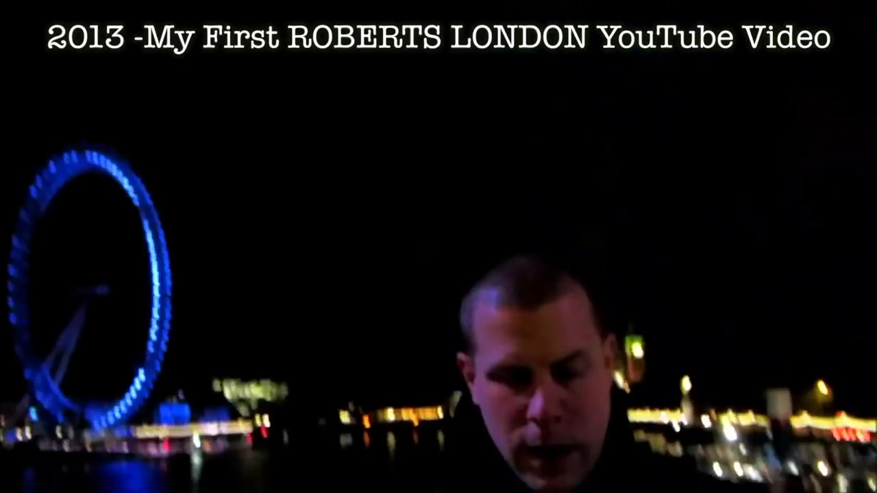 Barry beside the blue-lit London Eye in footage labelled as the first Roberts London video, from 2013.