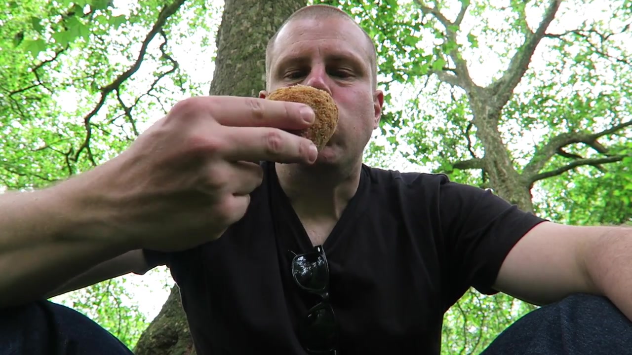 Barry Roberts holding a traditional Scotch egg in Green Park