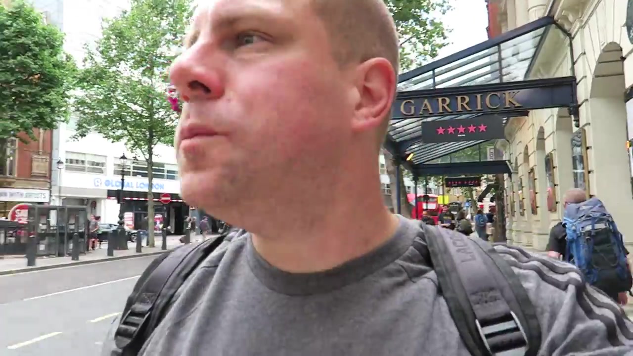 Barry Roberts walking along Charing Cross Road near the Garrick Theatre