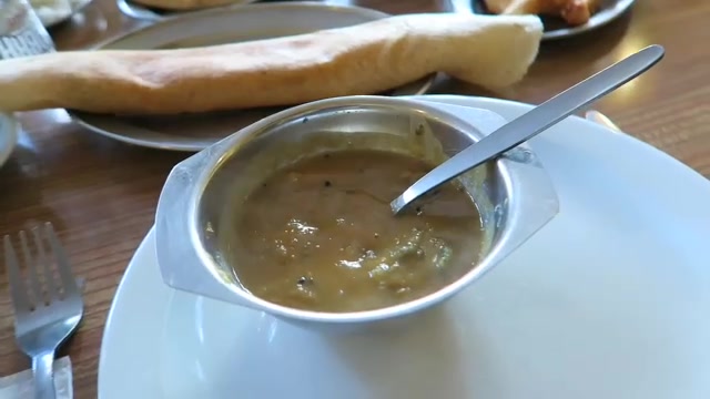 Sambar and masala dosa on the table at the India Club on the Strand