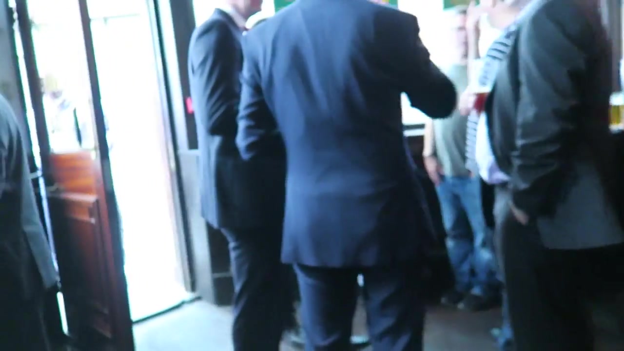 Customers in suits gathered near the Jamaica Wine House doorway in 2016
