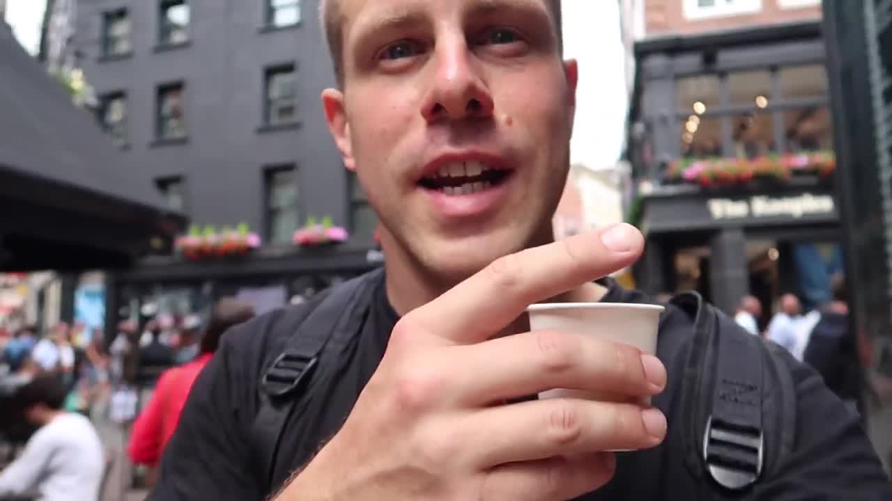 Barry Roberts holding a takeaway coffee near Carnaby Street