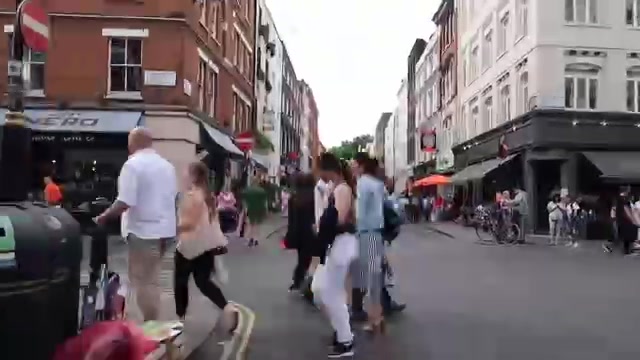 People walking along Frith Street near Bar Italia in Soho in June 2018