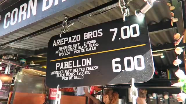 Arepazo Bros menu board showing arepa options and prices during the 2016 visit
