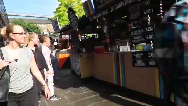Visitors walking past food stalls at KERB Camden Market in 2016