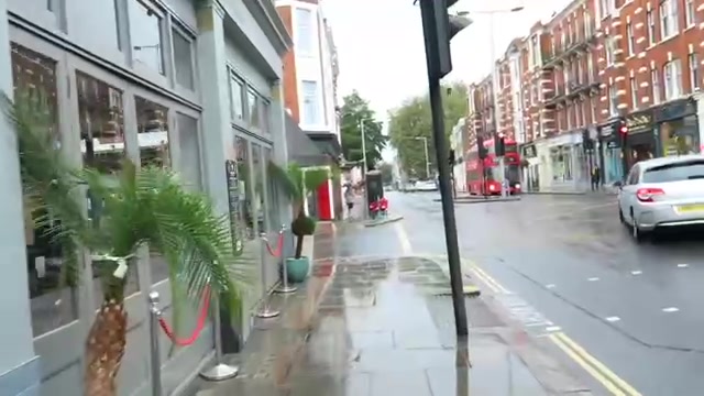 King’s Road Chelsea shopfronts and wet pavement in 2016